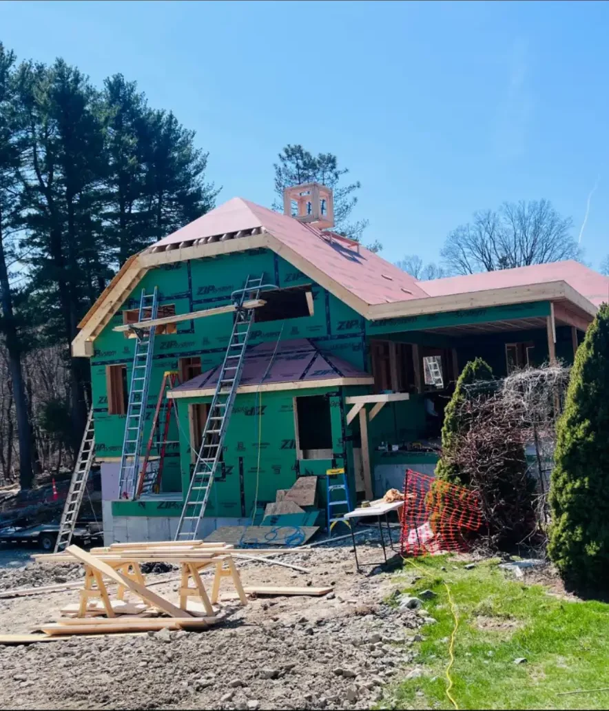 Roof framing and sheathing in progress